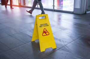 premises liability lawyer Atlanta, GA - "Caution wet floor" sign