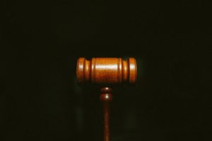 Wrongful Death Lawyer Atlanta, GA - A wooden gavel centered on a dark background with grain.