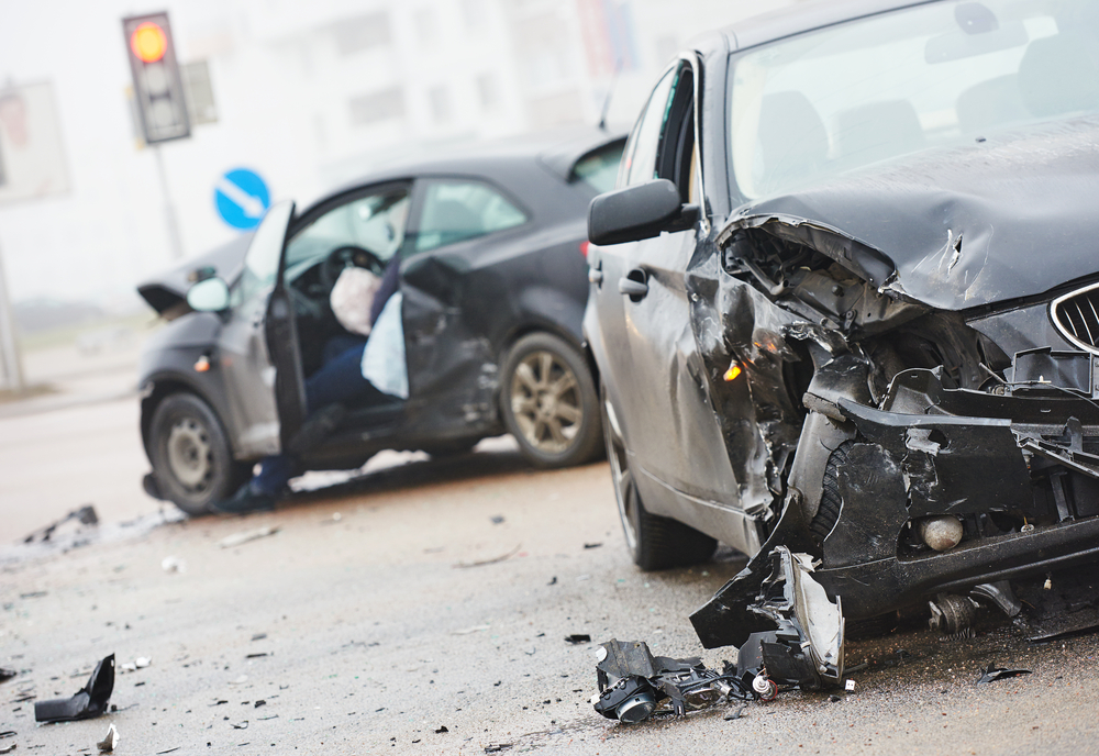 Common Types of Car Accidents - car crash accident on street, damaged automobiles after collision in city